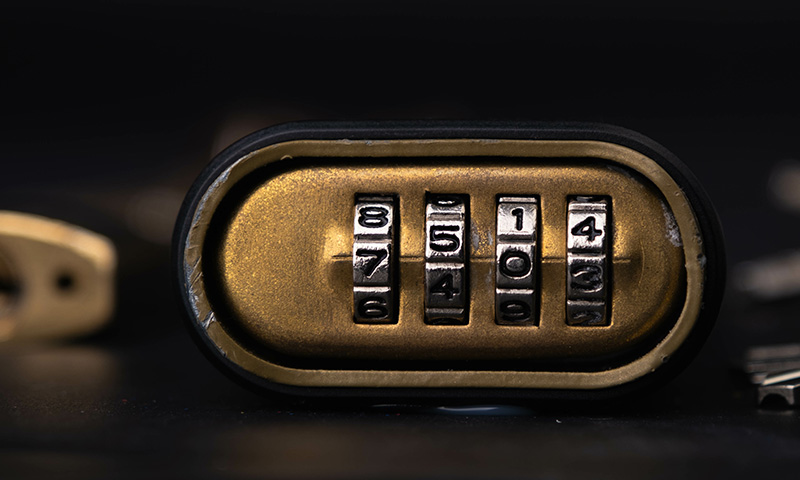 a gold lock with a four number combination